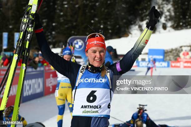Germany's Denise Herrmann celebrates after winning the IBU Biathlon World Cup Women's 10km pursuit race in Rasen-Antholz , Italian Alps, on January...