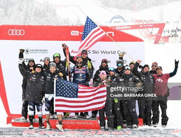 Travis Ganong celebrates with his team after the men's "Hahnenkamm ski course" downhill competition of the FIS Ski World Cup in Kitzbuehel, Austria,...