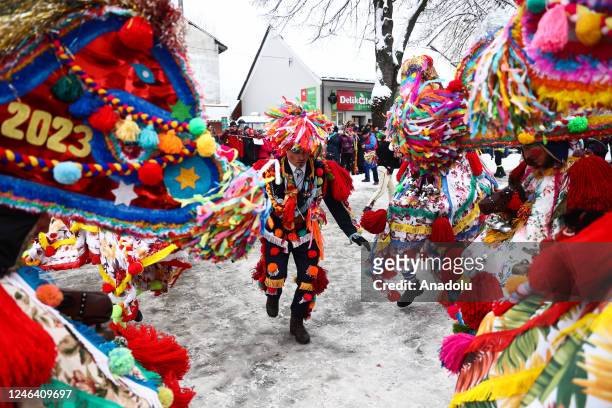 People dressed in traditional costumes take part in the âZywieckie Godyâ caroling groups parade in Milowka, Poland on January 21, 2023....