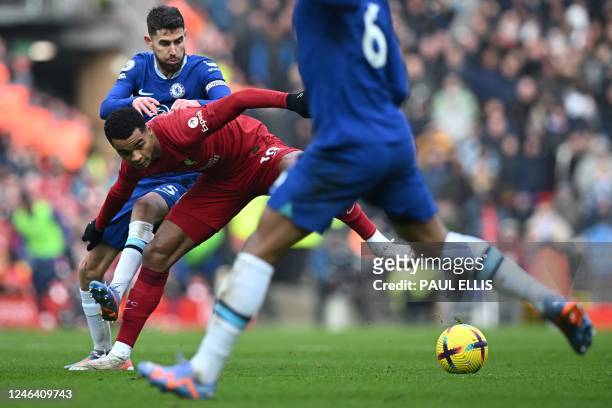 Chelsea's Italian midfielder Jorginho fights for the ball with Liverpool's Dutch striker Cody Gakpo during the English Premier League football match...