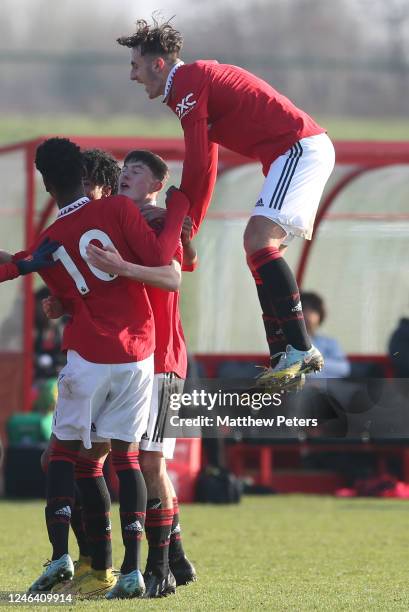 James Nolan of Manchester United U18s celebrates his sides third goal with team-mates during the U18 Premier League match between Manchester United...