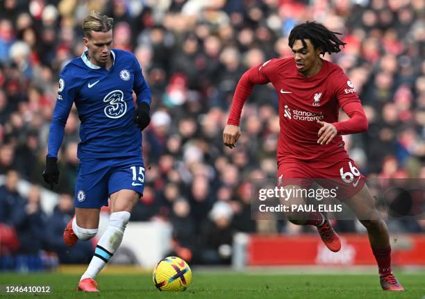 Chelsea's Ukrainian midfielder Mykhailo Mudryk fights for the ball with Liverpool's English defender Trent Alexander-Arnold during the English...