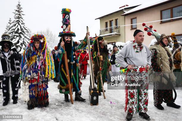 People dressed in traditional costumes take part in the âZywieckie Godyâ caroling groups parade in Milowka, Poland on January 21, 2023....