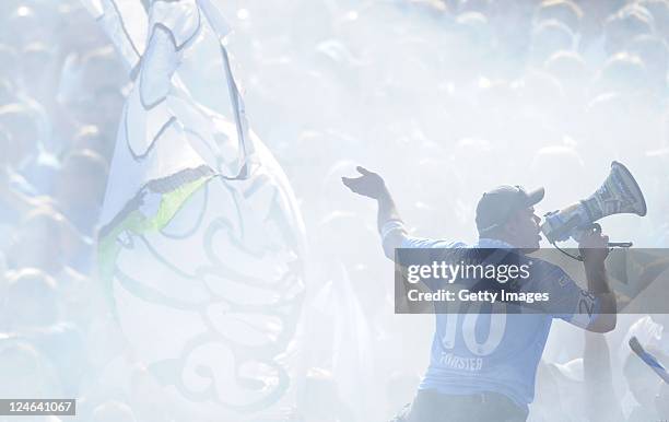 Fans of Chemnitz cheer during the Third League match between Carl-Zeiss Jena and Chemnitzer FC at Ernst-Abbe-Sportfeld stadium on September 11, 2011...