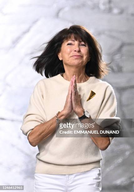 Hermes designer Veronique Nichanian gestures at the end of the Hermes Menswear Ready-to-wear Fall-Winter 2023-2024 collection show at Paris fashion...