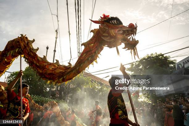 Balis Chinese community perform the dragon dance during Chinese New Year called Ngelawang ceremony on January 21, 2023 in Kuta, Bali, Indonesia. The...