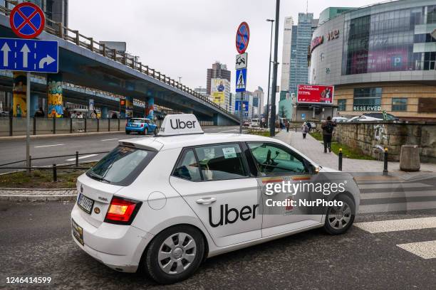 Uber taxi car is seen in the center of Warsaw, Poland on January 19, 2023.