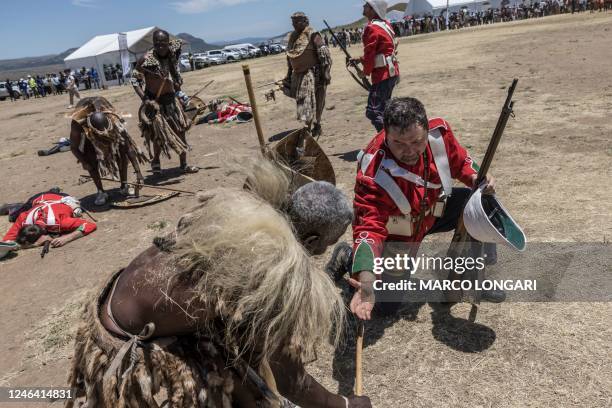 Member of the Amabutho Zulu regiments is congratulated by a member of the Dundee Diehards at the end of the Battle of Isandlwana, in Isandlwana on...