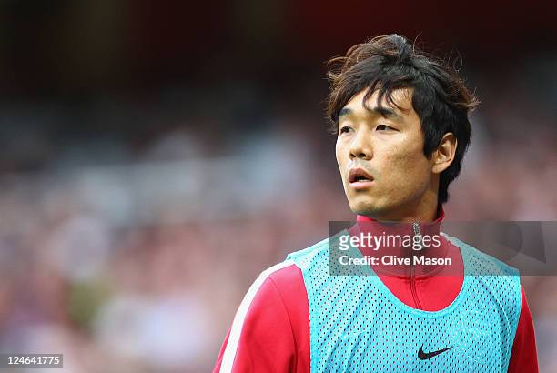 Park Chu-Young of Arsenal warms up during the Barclays Premier League match between Arsenal and Swansea City at Emirates Stadium on September 10,...