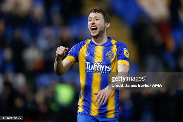 Matthew Pennington of Shrewsbury Town celebrates winning the game at full time during the Sky Bet League One between Shrewsbury Town and Cambridge...