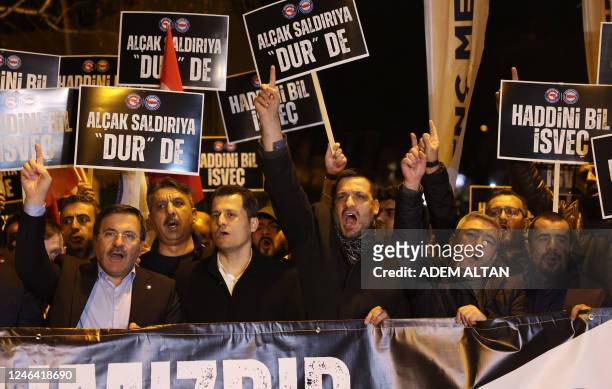 Protesters chant slogans during a demonstration outside the Sweden's embassy in Ankara on January 21, 2023 as Turkey denounced the permission granted...