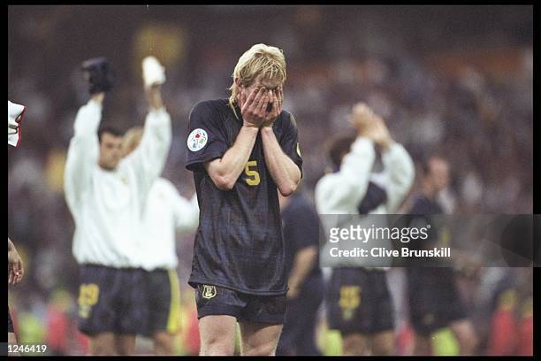 Colin Hendry of Scotland despairs as he realises Scotland are out of the European Football Championships on goal difference although Scotland beat...
