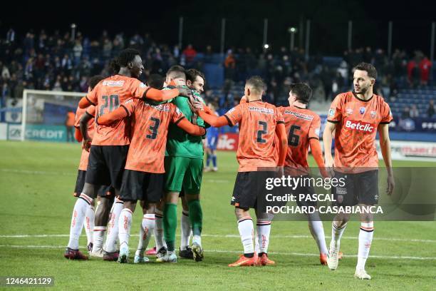 Lorient's players celebrate after winning the French Cup round of 32 football match between SC Bastia and FC Lorient at Armand Cesari stadium in...