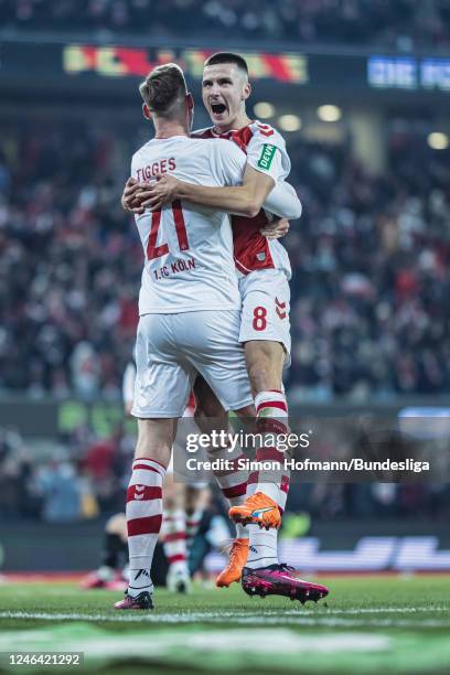 Dennis Huseinbasic of Köln celebrates his side's fifth goal with team mate Steffen Tigges during the Bundesliga match between 1. FC Köln and SV...