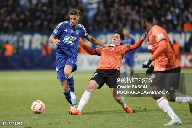 Bastia's French defender Kevin Van Den Kerkhof fights for the ball with Lorient's French midfielder Laurent Abergel during the French Cup round of 32...