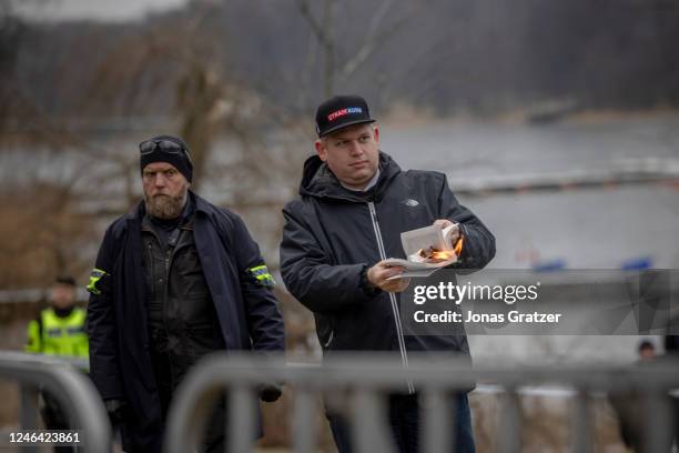 Rasmus Paludan burns a Koran outside of the Turkish embassy on January 21, 2023 in Stockholm, Sweden. Swedish authorities granted permission to a...