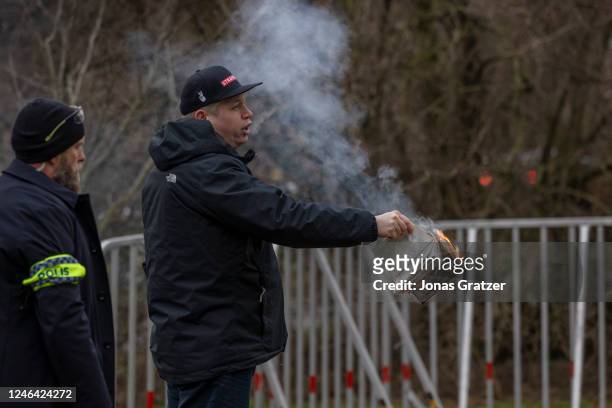 Rasmus Paludan holds a burning Koran outside of the Turkish embassy on January 21, 2023 in Stockholm, Sweden. Swedish authorities granted permission...