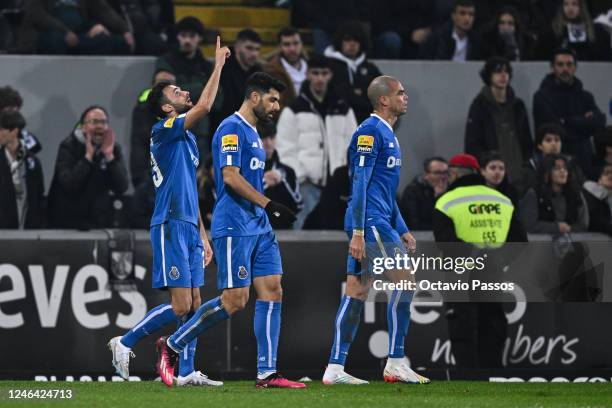 Joao Mario of FC Porto celebrates with teammates after scores his sides first goal during the Liga Portugal Bwin match between Vitoria Guimaraes and...