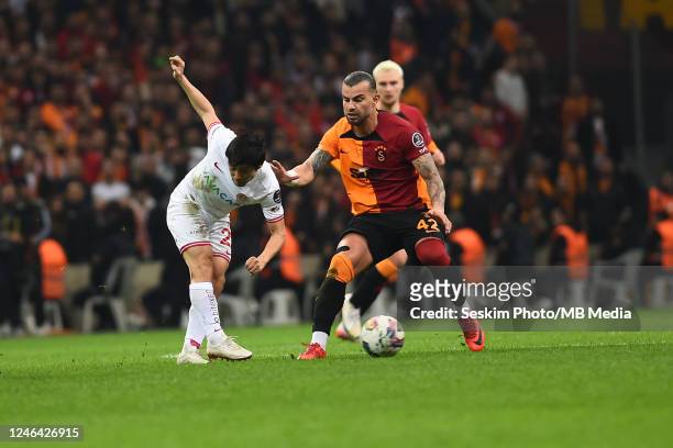 Abdulkerim Bardakci of Galatasaray and Shoya Nakajima of Antalyaspor battle for the ball during the Super Lig match between Galatasaray and...