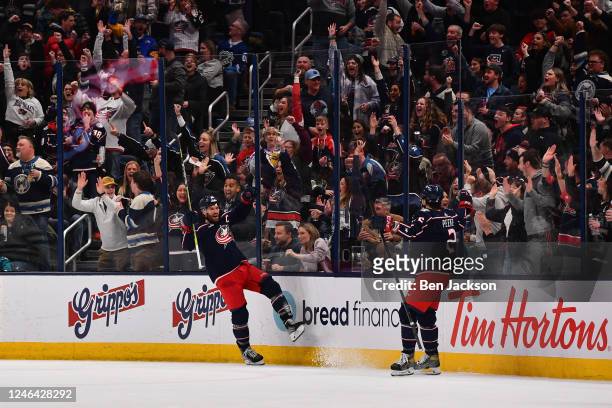 Boone Jenner of the Columbus Blue Jackets celebrates with teammate Andrew Peeke of the Columbus Blue Jackets after scoring a goal during the second...
