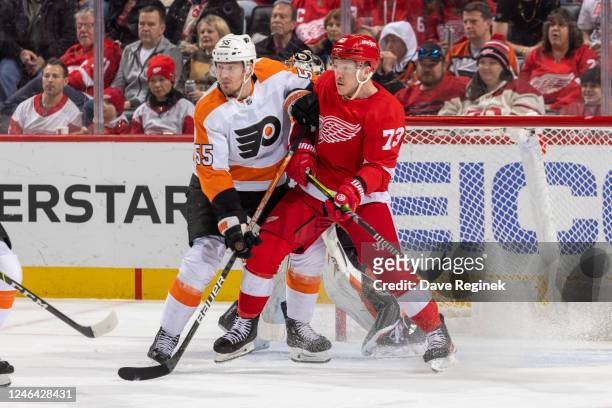 Rasmus Ristolainen of the Philadelphia Flyers defends against Adam Erne of the Detroit Red Wings during the first period of an NHL game at Little...