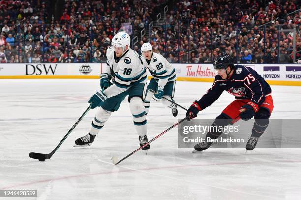 Steven Lorentz of the San Jose Sharks skates with the puck as Tim Berni of the Columbus Blue Jackets defends during the second period of a game at...