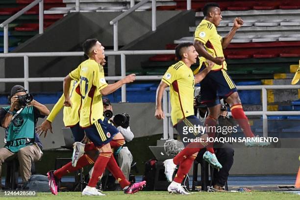 Colombia's Oscar Cortes celebrates after scoring against Peru during the South American U-20 championship first round football match at the Pascual...
