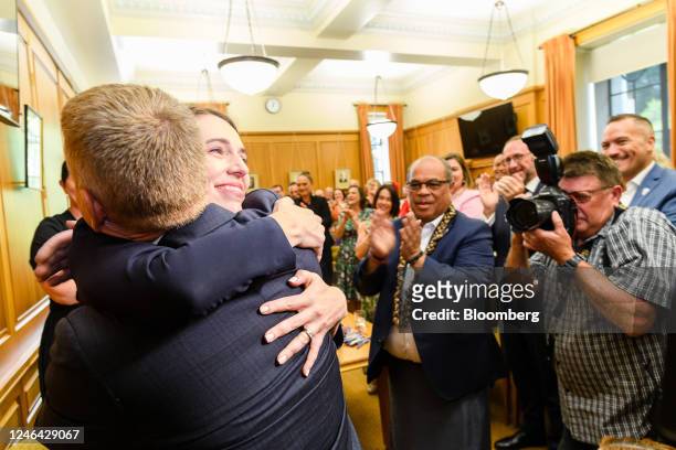 Jacinda Ardern, New Zealand's prime minister, hugs Chris Hipkins, New Zealand's incoming prime minister, during a cabinet caucus meeting in...