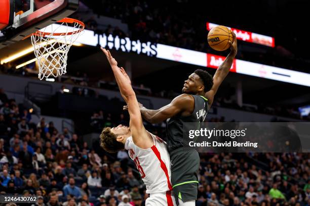 Anthony Edwards of the Minnesota Timberwolves dunks the ball over Alperen Sengun of the Houston Rockets in the third quarter of the game at Target...