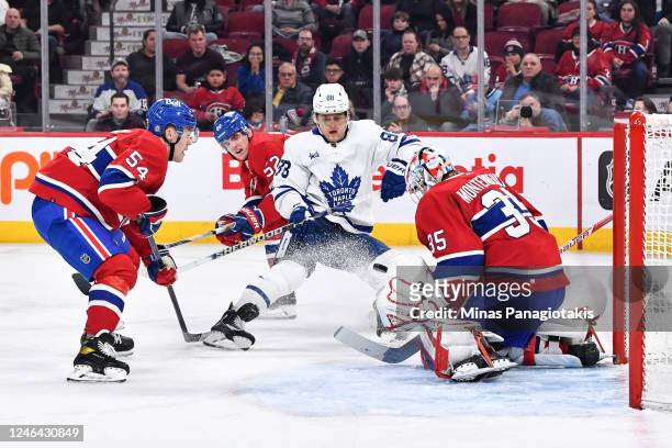 William Nylander of the Toronto Maple Leafs shoots the puck towards goaltender Sam Montembeault of the Montreal Canadiens during the third period at...
