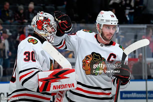 Jaxson Stauber and Jonathan Toews of the Chicago Blackhawks celebrate Staubers first NHL win after beating the St. Louis Blues 5-3 at the Enterprise...