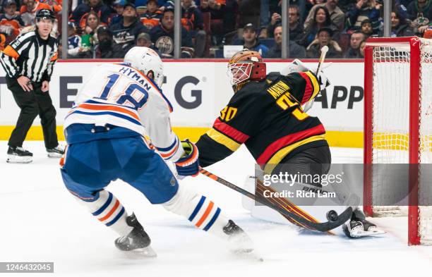 Zach Hyman of the Edmonton Oilers scores the goal against goalie Spencer Martin of the Vancouver Canucks during the first period in NHL action on...