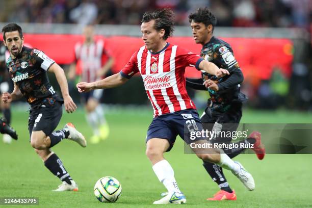 Ruben González of Chivas fights for the ball with Brian García of Toluca during the 3rd round match between Chivas and Toluca as part of the Torneo...