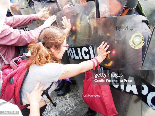 Students confront the police at the gate of the Lima prefecture after the police raided the National University of San Marcos, one of the oldest in...