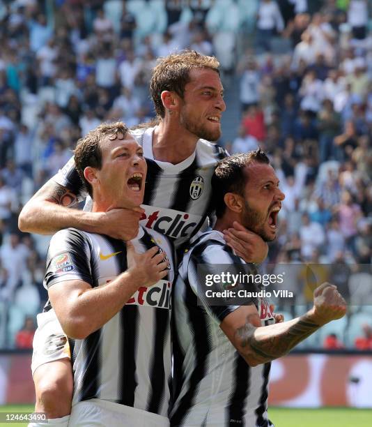 Simone Pepe of Juventus FC celebrates scoring his team's second goal with team-matess Stephan Lichtsteiner and Claudio Marchisio during the Serie A...