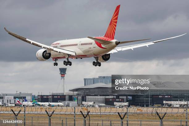 Air India Boeing 787 Dreamliner aircraft as seen on final approach flying for landing at the runway of London Heathrow airport during a cloudy day...