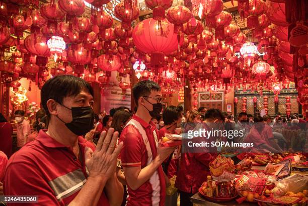 People seen praying at the Chinese temple during the Lunar new year celebration at Bangkok's Chinatown.