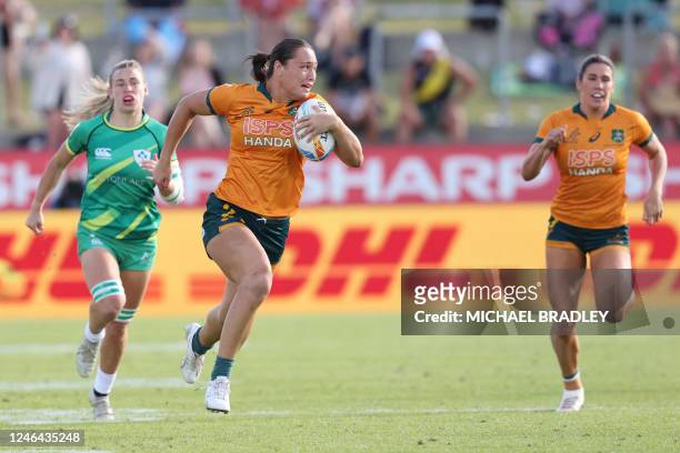 Bienne Terita of Australia races away for a try during the women's bronze medal match between Ireland and Australia on day two of the World Rugby...