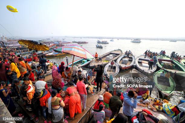 Hindu devotees gather to take a holy dip at the Ganges River, on the auspicious bathing day of 'Mauni Amavasya' during the annual religious 'Magh...