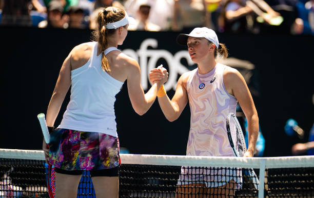 Elena Rybakina of Kazakhstan and Iga Swiatek of Poland shake hands at the net after their fourth round match on Day 7 of the 2023 Australian Open at...