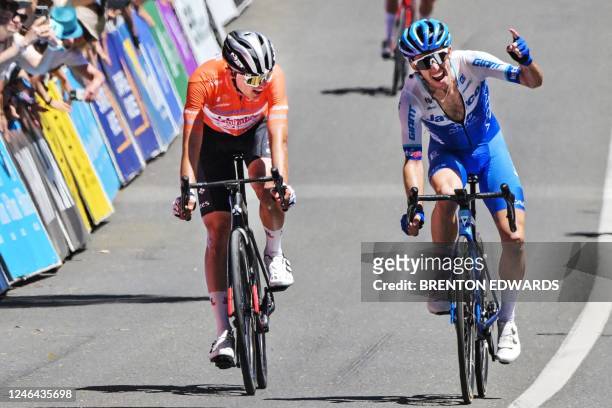 Tour winner Australian Jay Vine from UAE Team Emirates watches UK cyclist Simon Yates from Team Jayco - Alula win the final stage the Tour Down Under...