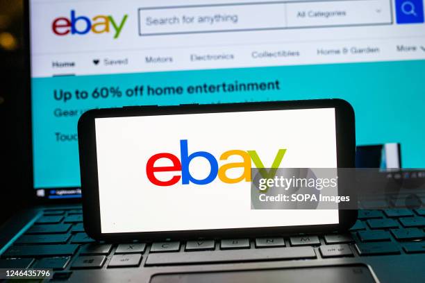 In this photo illustration an Ebay logo seen displayed on a smartphone.