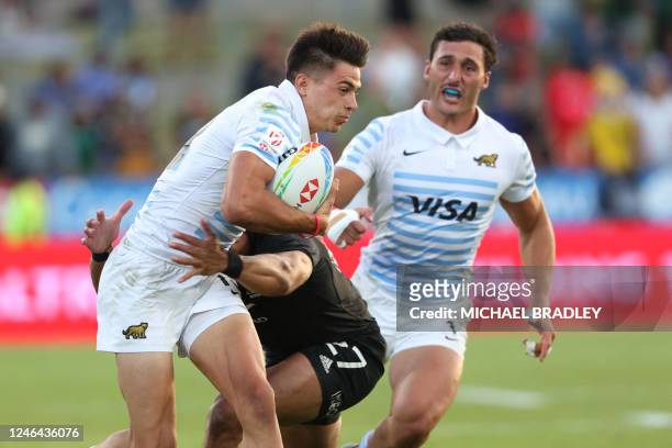 Marcos Moneta of Argentina is tackled during the men's final between New Zealand and Argentina on day two of the World Rugby Sevens series at FMG...