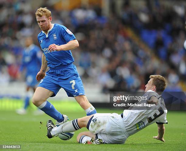 Chris Burke of Birmingham in action with Tony Craig of Millwall during the npower Championship match between Birmingham City and Millwall at St...