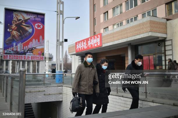 People walk on a street in Pyongyang on January 22, 2023.