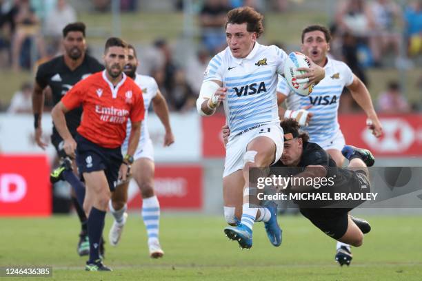 Luciano Gonzalez of Argentina is tackled by Leroy Carter of New Zealand during the men's final between New Zealand and Argentina on day two of the...