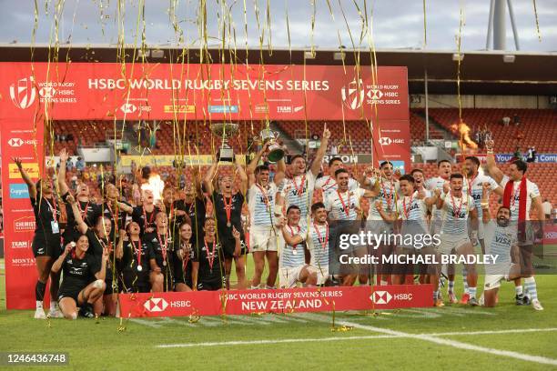 New Zealand's women's team and Argentina's men's team celebrate their wins after the final matches on day two of the World Rugby Sevens series at FMG...