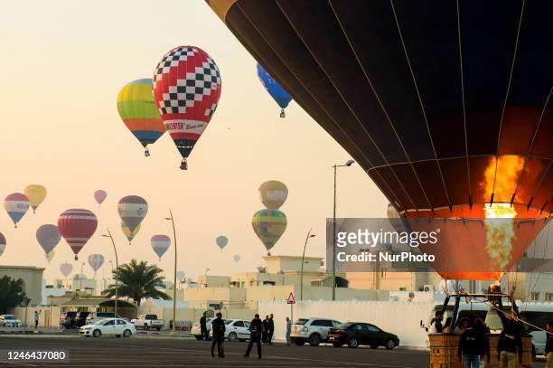 Hot air balloons rise during the Qatar balloon festival 2023 near Khalifa International Stadium in Doha ,Qatar on 22 January 2023.The third edition...