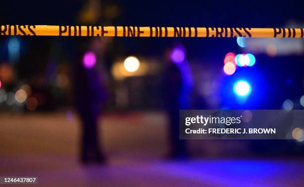 Police tape is pictured at the scene near the intersection of Garvey and Garfield Avenue in Monterey Park, California, on January 22 where police are...
