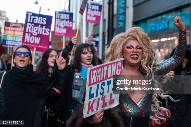 Trans rights activists march through central London after a protest outside Downing Street on 21 January 2023 in London, United Kingdom. The protest...